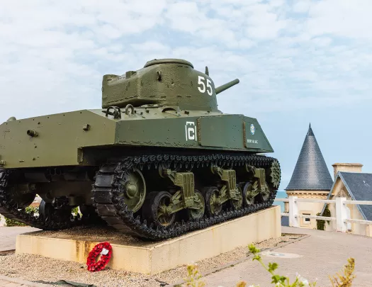 Dark green tank on the roof of a building