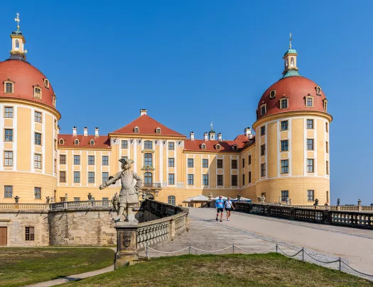 Exterior view of yellow and brown cathedral-like building