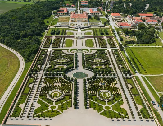 Sky view of a large outdoor garden leasing to a large building complex