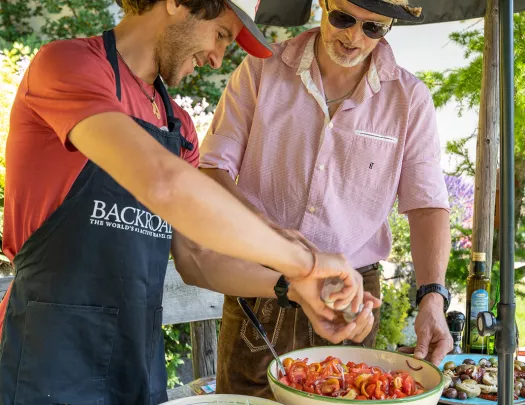 Leader & guide seasoning bowl of tomatoes. 