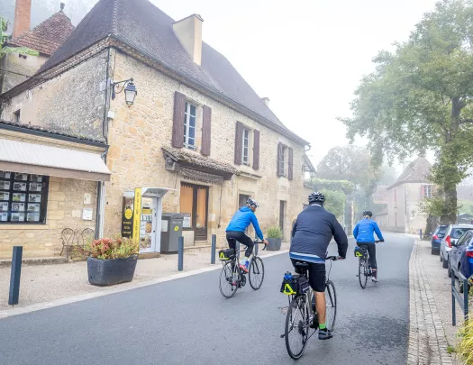 Backroads Guests Biking Through Town