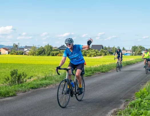 Bikers riding down a path