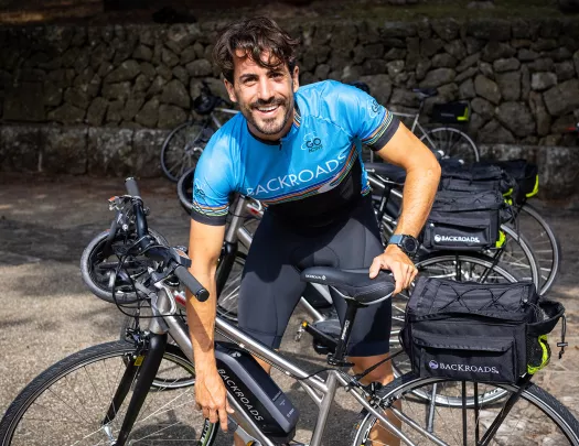 Backroads leader fixing e-bike.