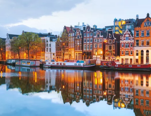 Houses lit up along a canal