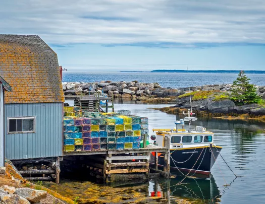 Shot of fishing vessel at port and lobster/crab traps.