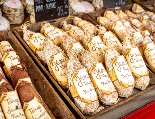 Close-up shot of wrapped cured meats.