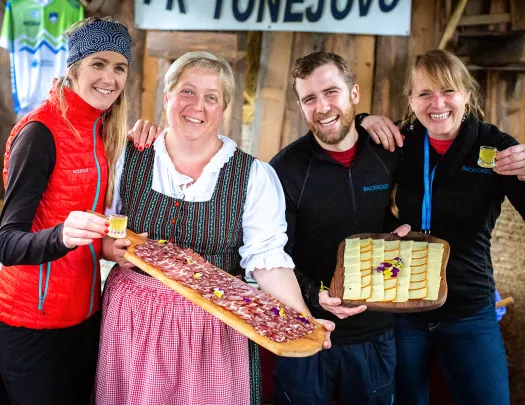 Backroads guests posing with local meats and cheeses