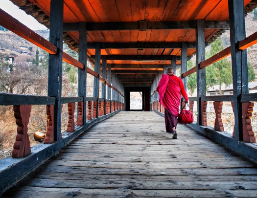 Monk walking along a corridor in Bhutan