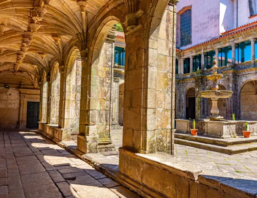 Ancient building courtyard with pillars and a fountain