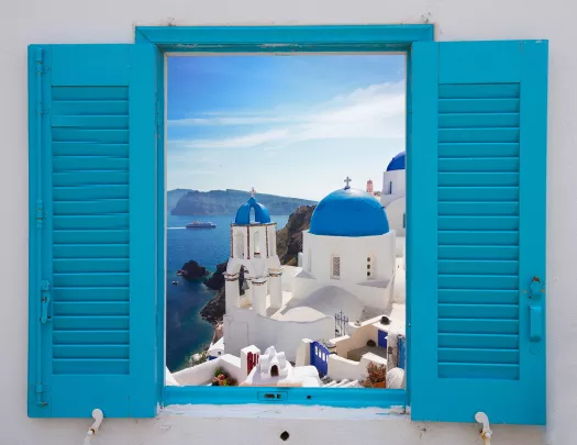 Light blue windowsill, overlooking blue and white Mediterranean domed houses.
