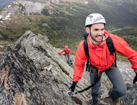 Backroads guests scaling a rocky mountain terrain