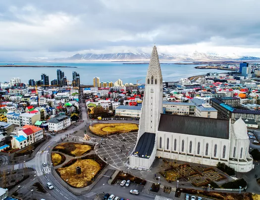 Bird's eye shot of The Hallgrimskirkja and it's surrounding city.