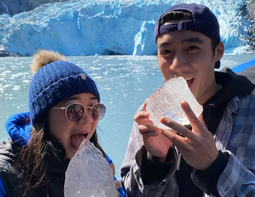 Two guests eating ice in Alaska