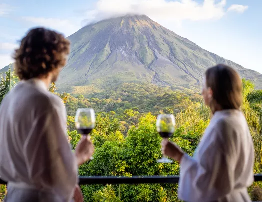 Enjoying Wine Looking up Arenal Volcano Costa Rica