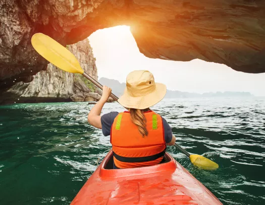 Kayaking among stone arches and cliffs in Vietnam