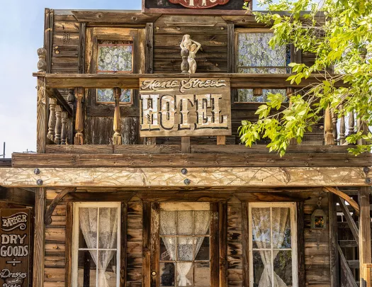 Storefront shot of the "MANE STREET HOTEL", old west style building.