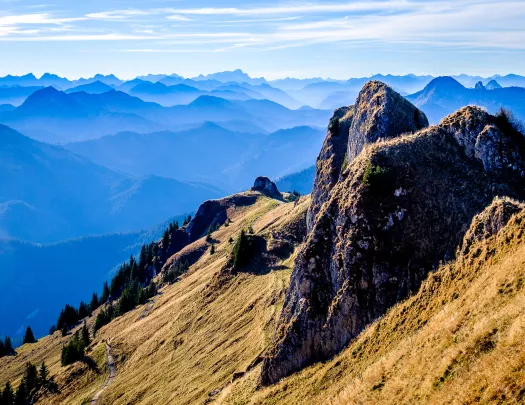 Rocky hill with large mountains in the distance