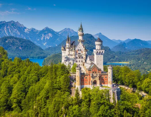 Beautiful view of world-famous Neuschwanstein Castle, the 19th century Romanesque Revival palace built for King Ludwig II, with scenic mountain landscape near Fussen, southwest Bavaria, Germany