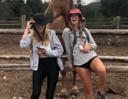 Backroads guests posing with a horse