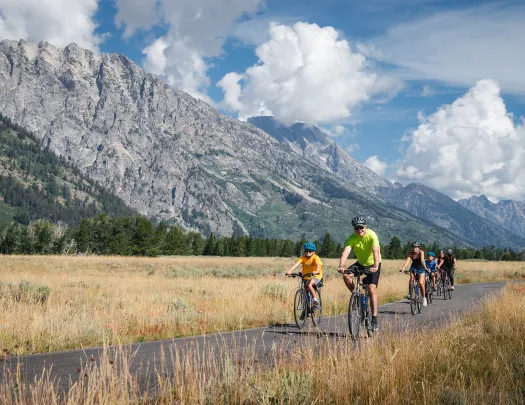 Backroads family smiling while biking 