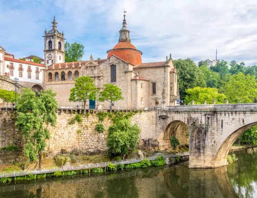 old stone buildings next to a river