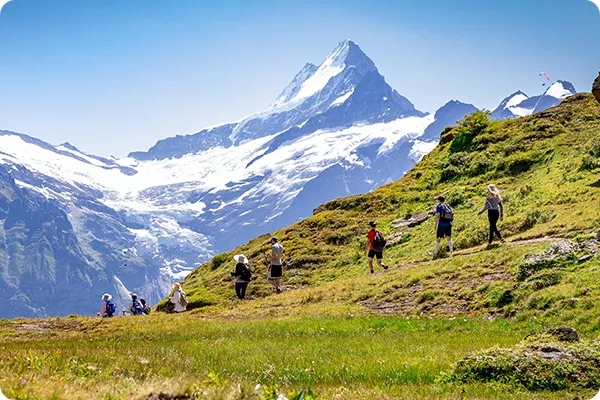 Hikers walking along a path in Switzerland