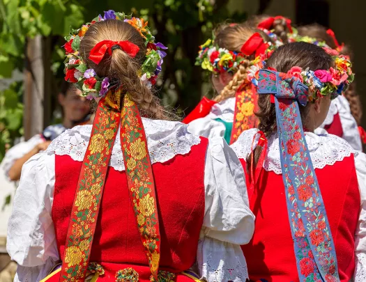 Women with German braids and ribbons in hair.