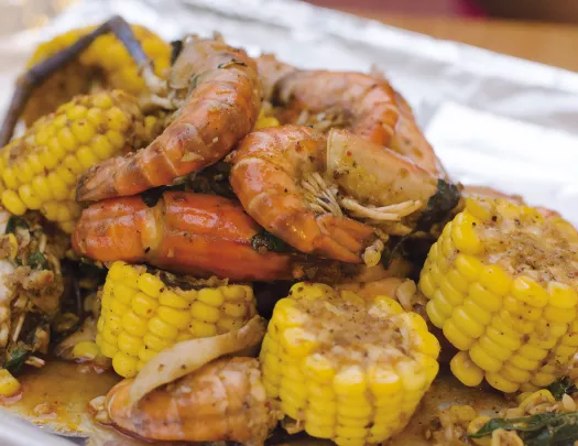 Close-up of shrimp boil ingredients.