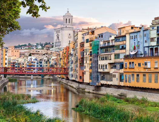Wide shot of Onyar River running through Girona and it's colorful buildings.