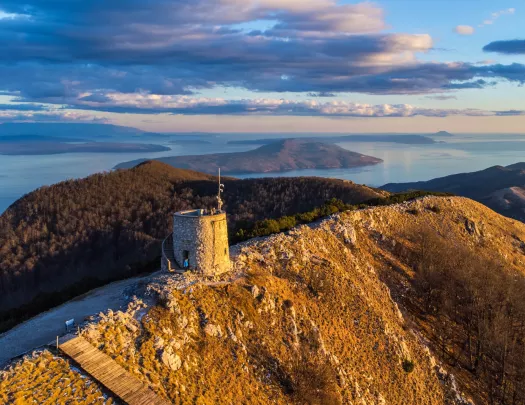 stone watchtower on a mountain peak