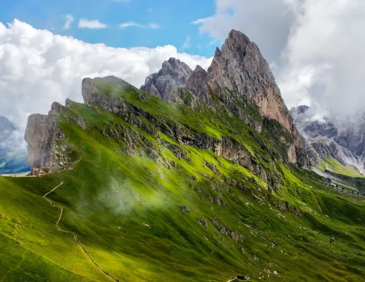 Steep mountain peaks covered in grass