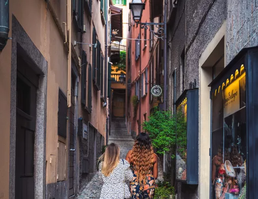 Two guests walking down narrow alleyway.