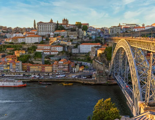 Wide shot of downtown Porto, bridge, river.