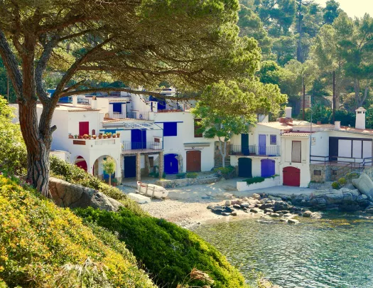 Shot of colorful coastal houses of Cala s'Alguer.