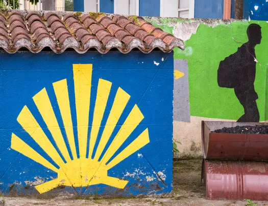 Close-up of wall paintings, blue wall, yellow shell.