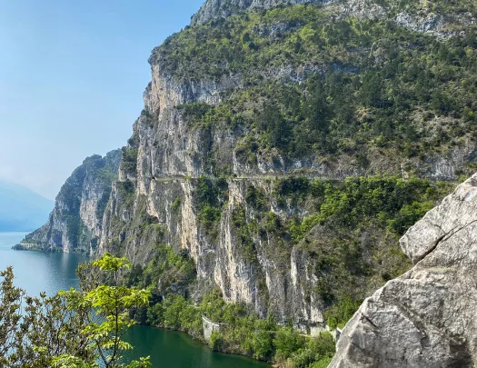 Wide shot of craggy, Italian coast cliffs. Ocean to left.