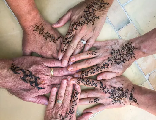 A group of hennaed hands