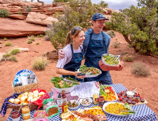 two trip leaders with a bountiful backroads picnic