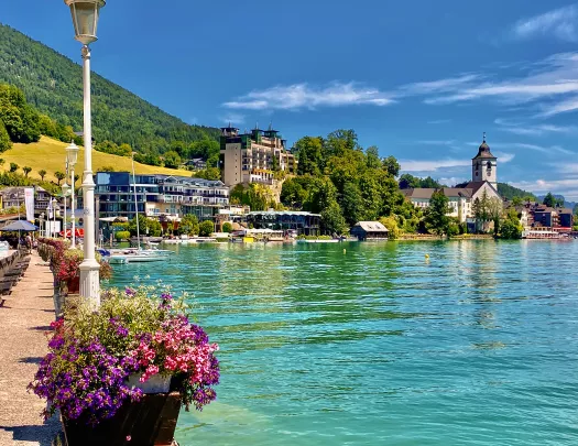 Port with blue water and benches along the fence